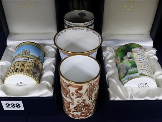 Four Halcyon Days enamel vases/beakers and a porcelain vase